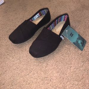 TOMS brand new black shoes...never been worn...